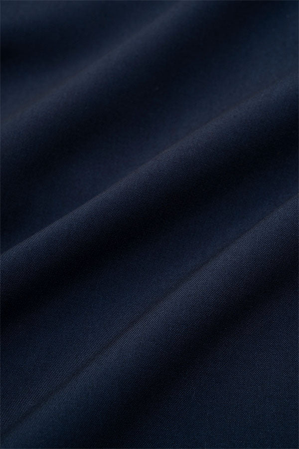 Wide tuck pants